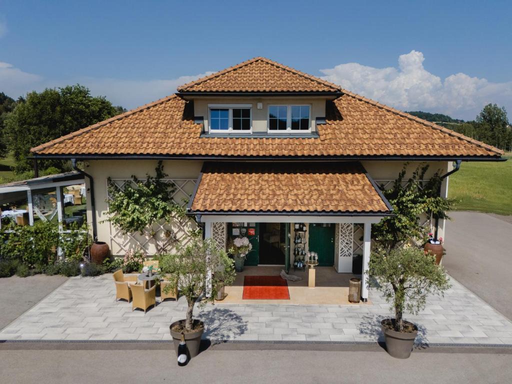 a house with a building with a roof at Fischerhaus in Moosburg