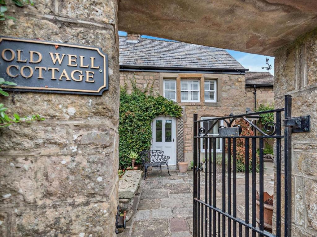 a gate to a house with a sign on it at 2 Bed in Bakewell oc-61862 in Baslow