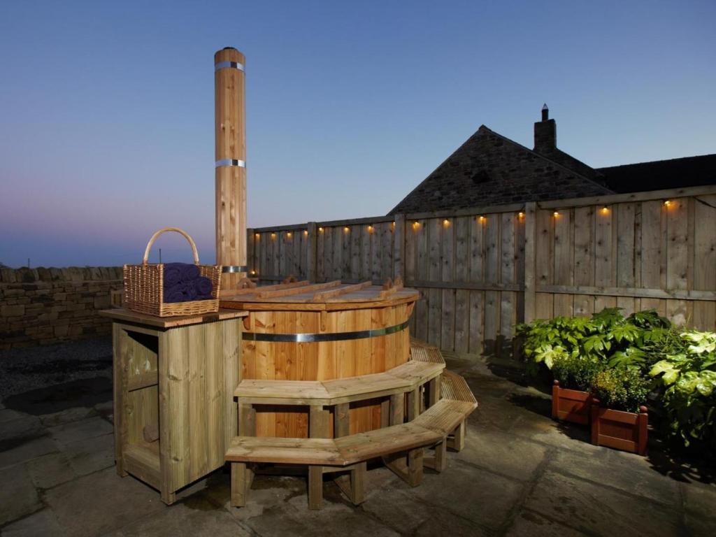 a wooden tub sitting next to a wooden fence at 3 Bed in Consett oc-29403 in Lanchester