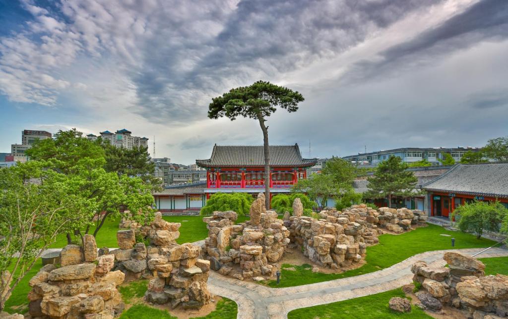 a garden of rocks in front of a building at Chengde Imperial Mountain Resort in Chengde