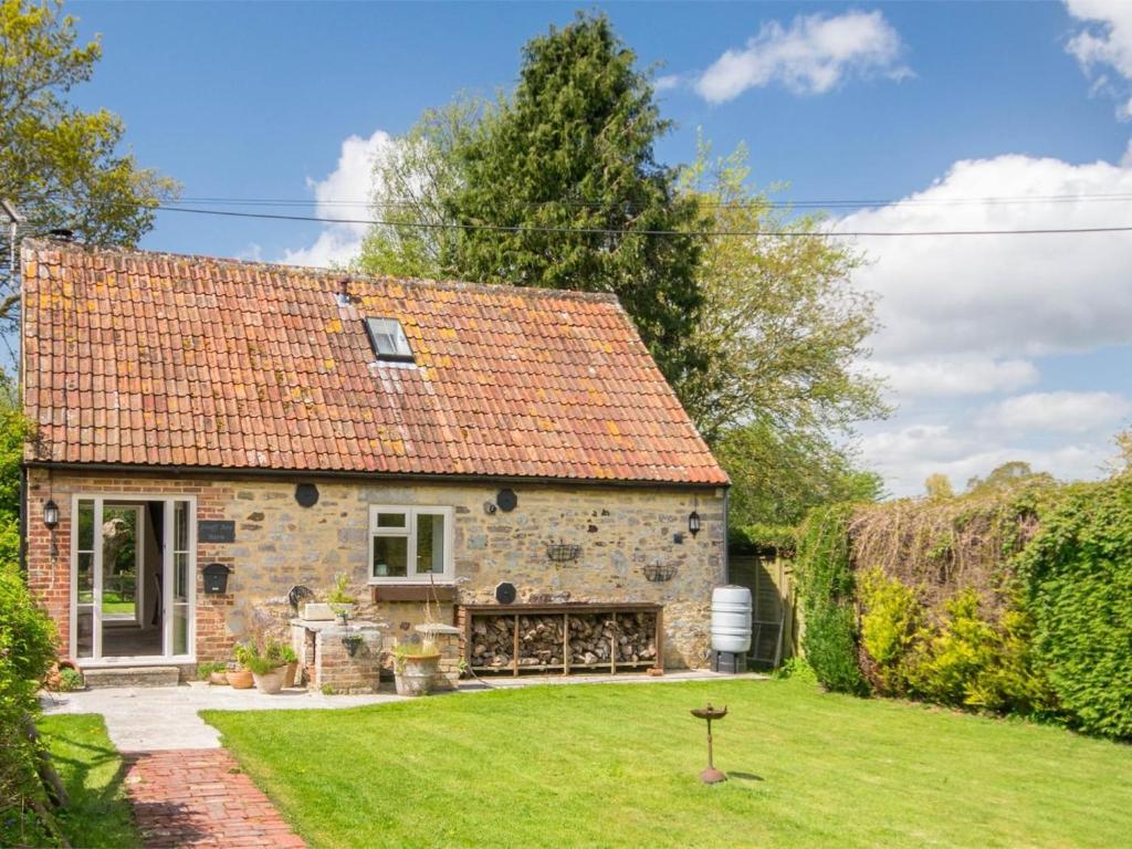 an old stone house with a grass yard at 2 Bed in Wareham oc-dc184 in Stoborough