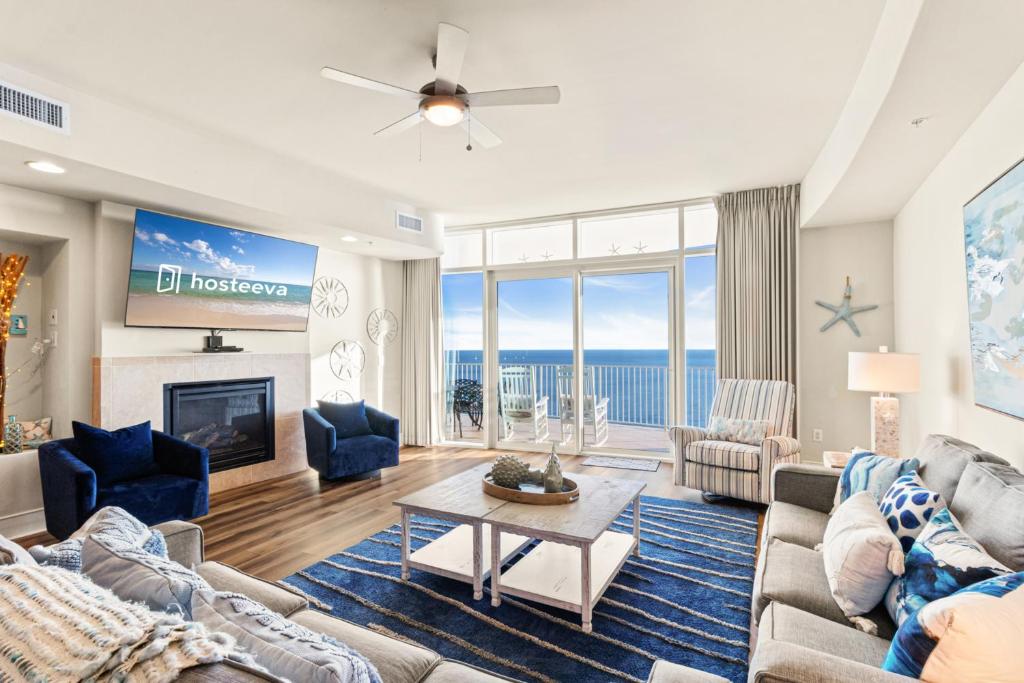 a living room with a couch and a table at Turquoise 1908C in Orange Beach