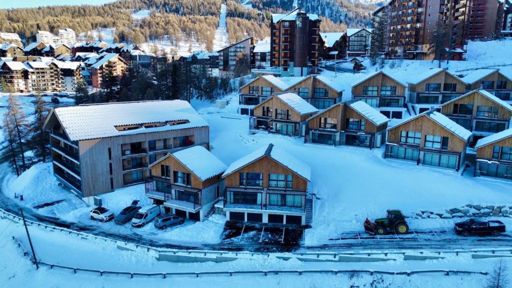 an aerial view of a town with snow covered buildings at Chalet César in Risoul