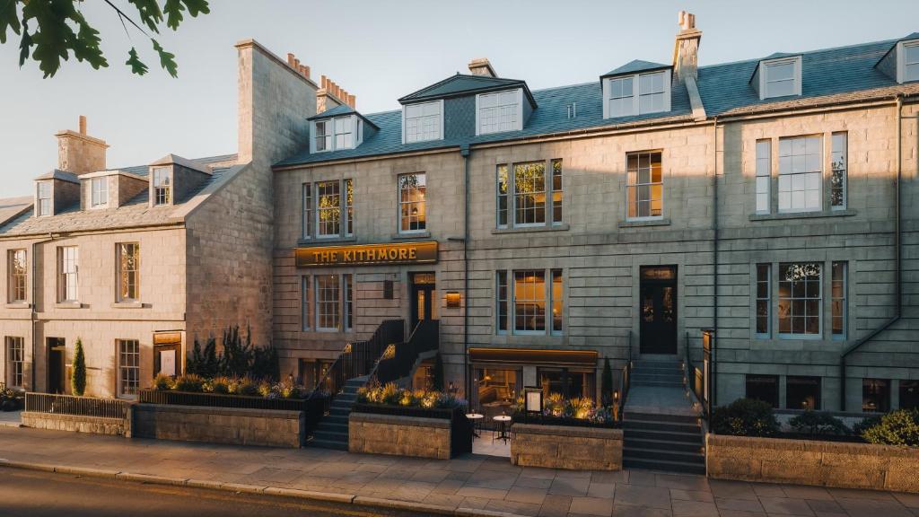 a large stone building on a city street at The Kithmore in St. Andrews