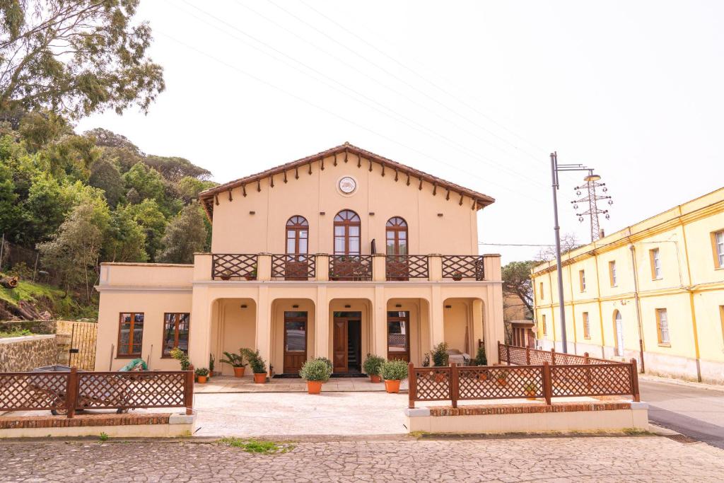 a large building with a balcony on top of it at Albergo Al Cinghiale in Montevecchio