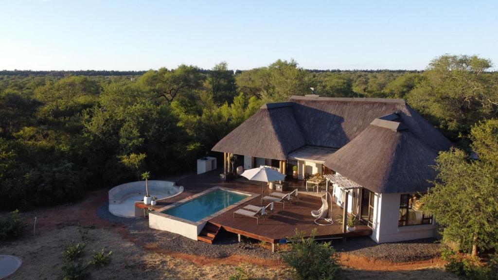 an aerial view of a house with a swimming pool at Villa Blaaskans in Hoedspruit