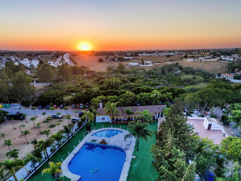 an aerial view of a resort with a pool at Bungalows & Glamping Conil Playa in Conil de la Frontera