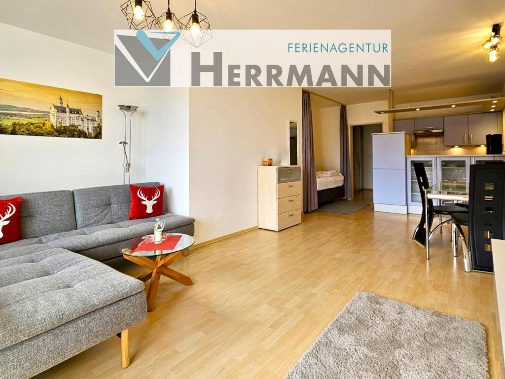 a living room with a couch and a table at Ferienwohnung Panoramablick in Füssen