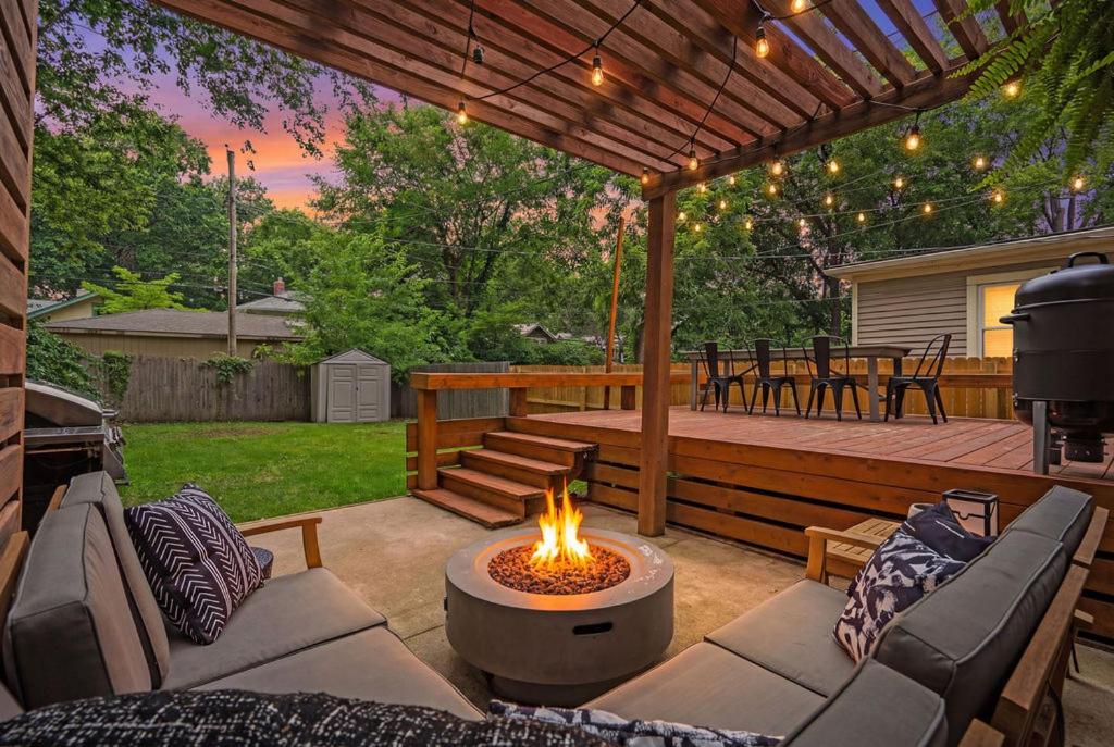 a patio with a fire pit and a grill at Entertainer - Brookside Walkable Firepit in Kansas City