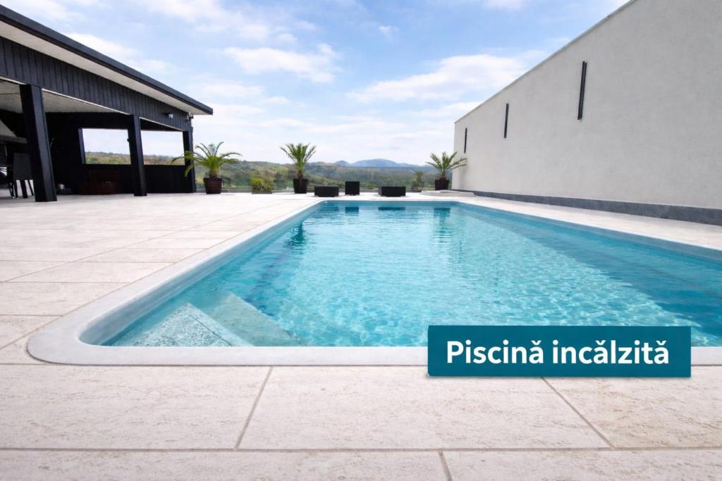 a swimming pool on the side of a building at BlueMaria in Eşelniţa