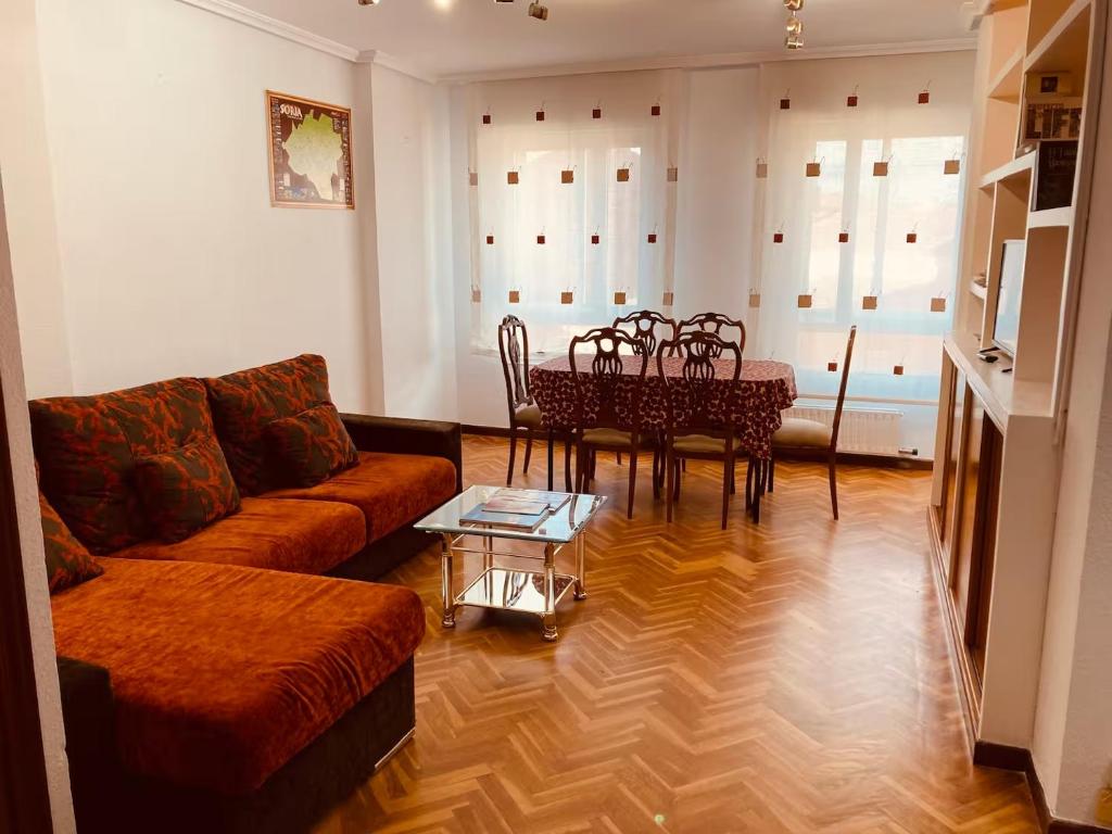 a living room with a couch and a table at La Florida 43 in Soria