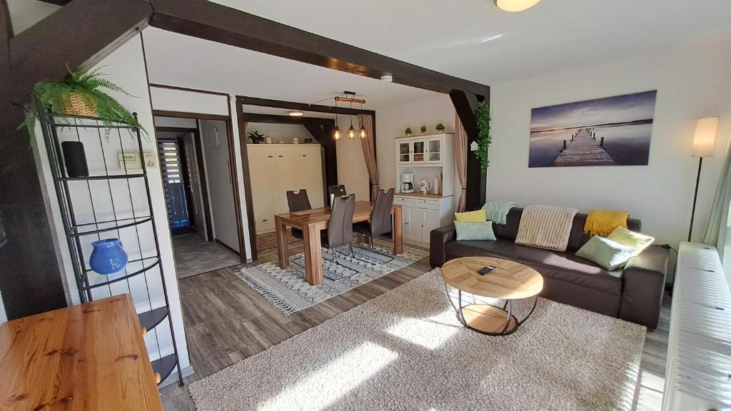 a living room with a couch and a table at Ferienwohnung Schäfer in Siegsdorf