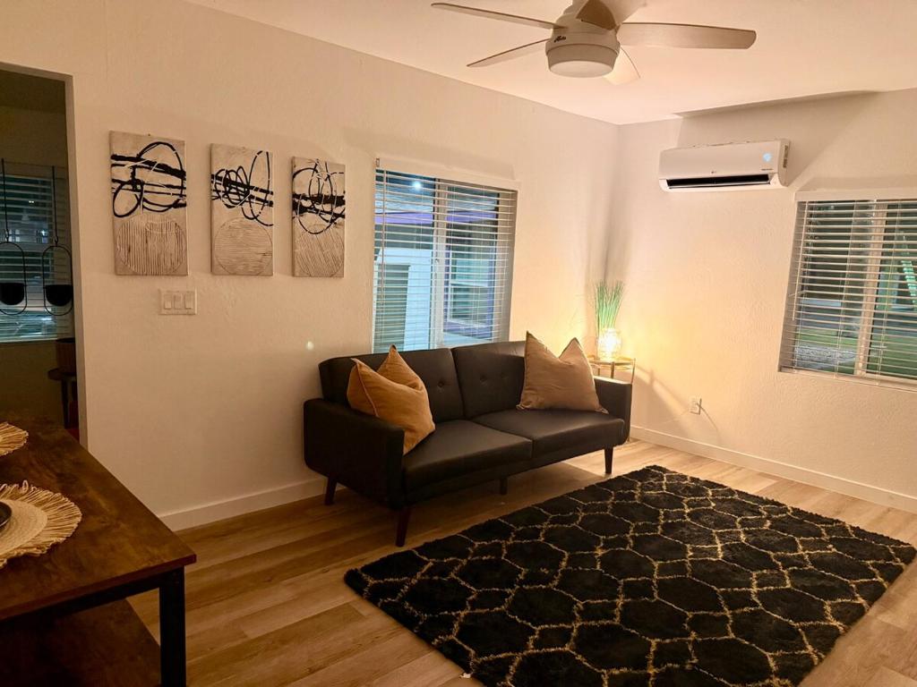 a living room with a couch and a table at Azure Casita in Tempe