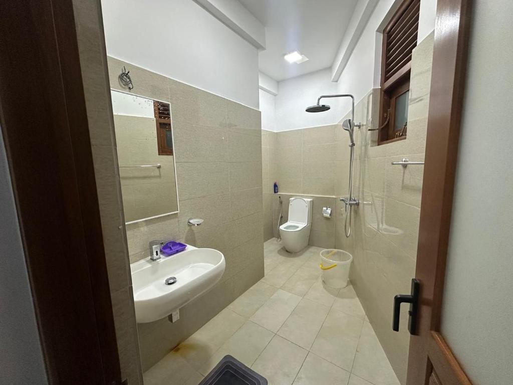 a bathroom with a sink and a toilet at EL Bethel House in Wattala