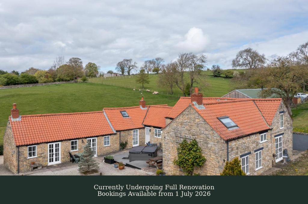 an aerial view of a house with orange roof at Rose Cottage - Sands Farm in Wilton
