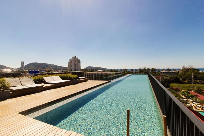 a large swimming pool on top of a building at The Deck Condominium Patong Beach in Patong Beach