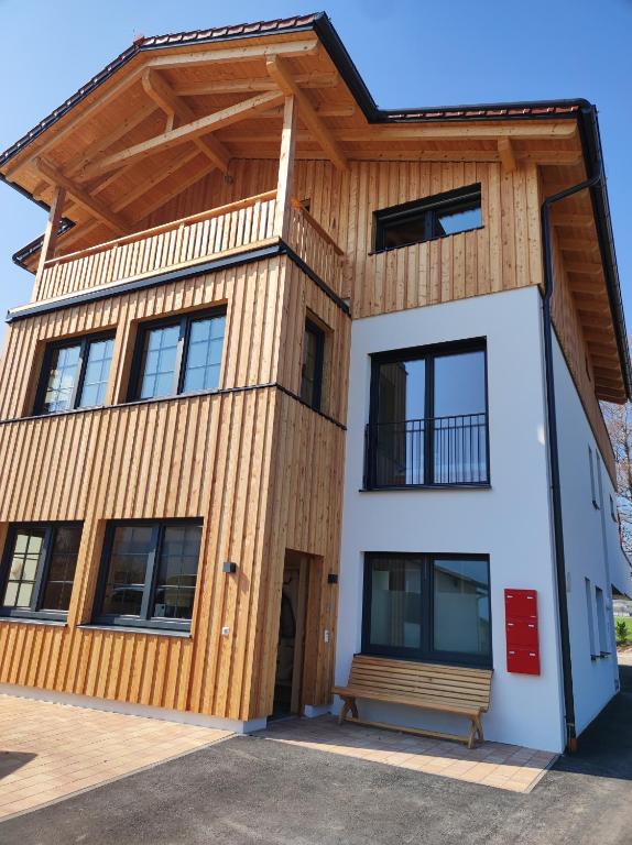 a house with a wooden roof at "Villa Barta am See" - Salzkammergut erleben in Traunkirchen