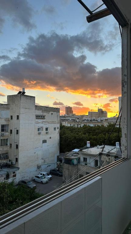 a view from a window of a city at sunset at Cringe Boutique APT in Netanya