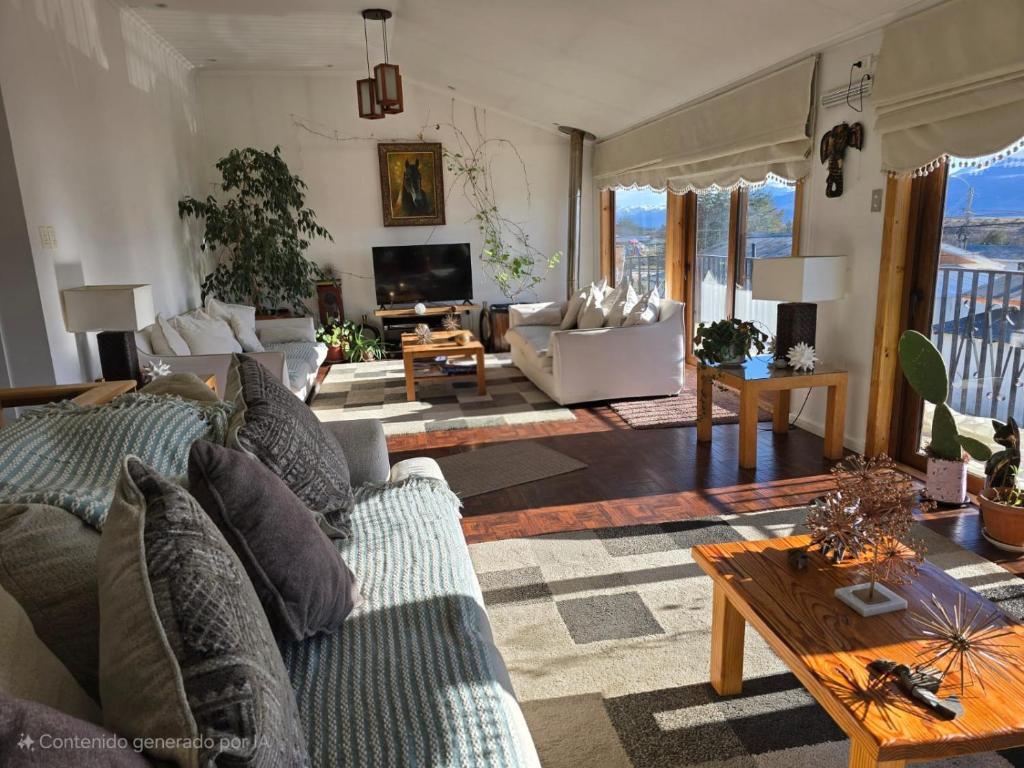 a living room with a couch and a table at Akainij in Puerto Williams