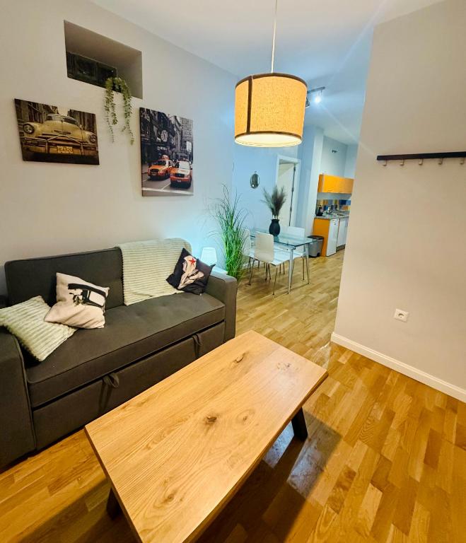 a living room with a couch and a coffee table at Apto Tramontana 98 in El Puerto de Santa María