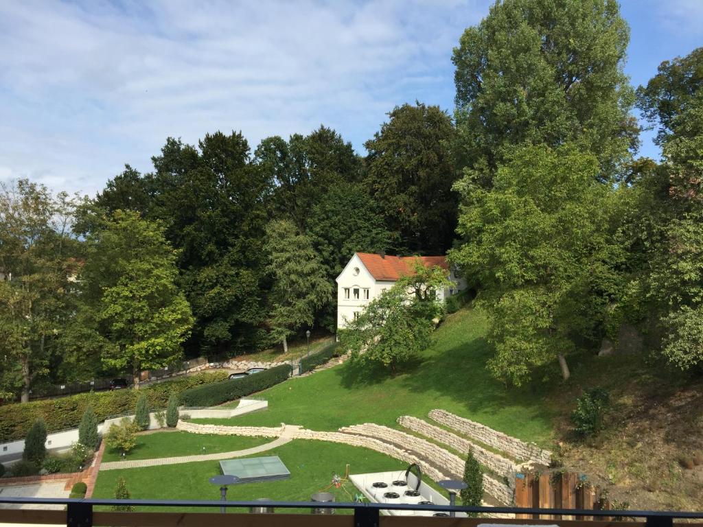 a house on top of a hill with a yard at Gabi`s Villa am Hang in Bad Aibling