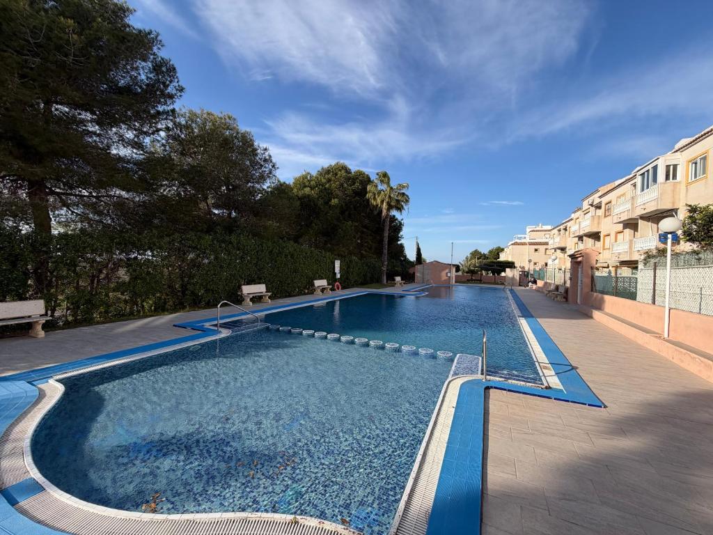 a large swimming pool in a building at Apartment A&T La Mata in La Mata