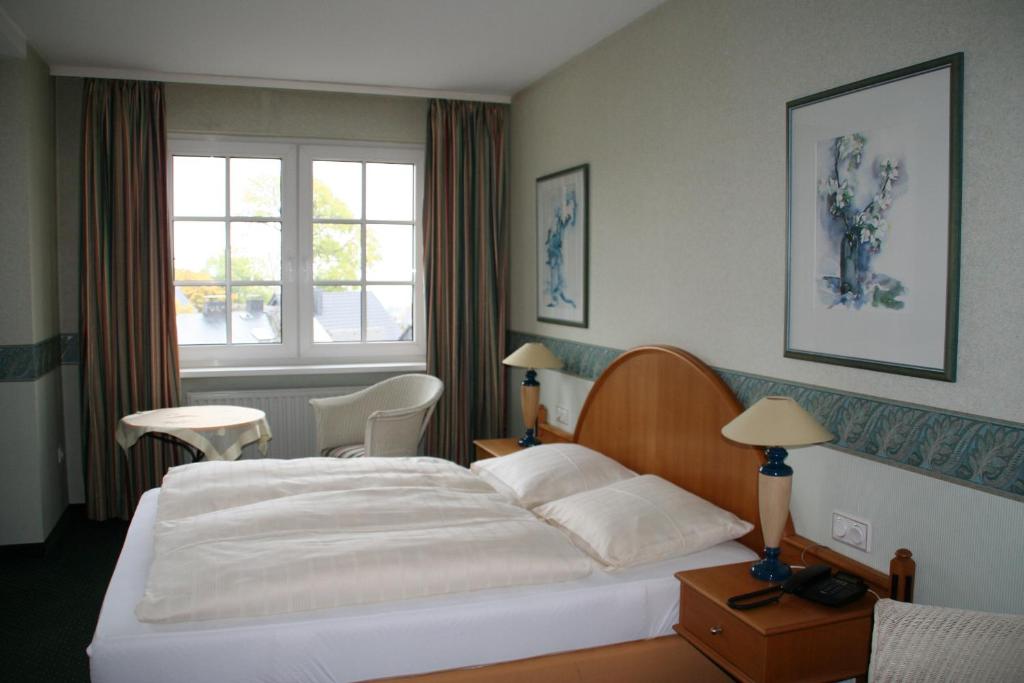 Postel nebo postele na pokoji v ubytování Hotel Rech