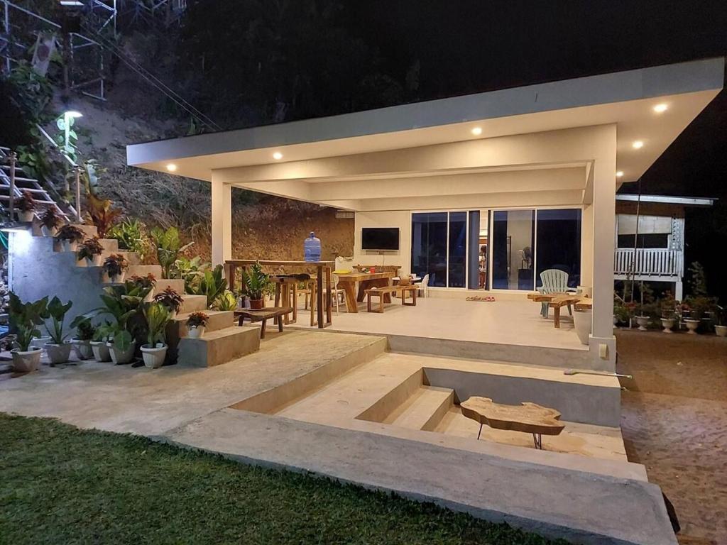 a house with a patio at night at Costa Moriah Manticao PH in Manticao