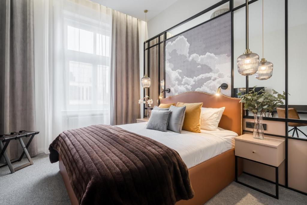 a bedroom with a bed and a large window at Budapest Cereja Boutique in Budapest