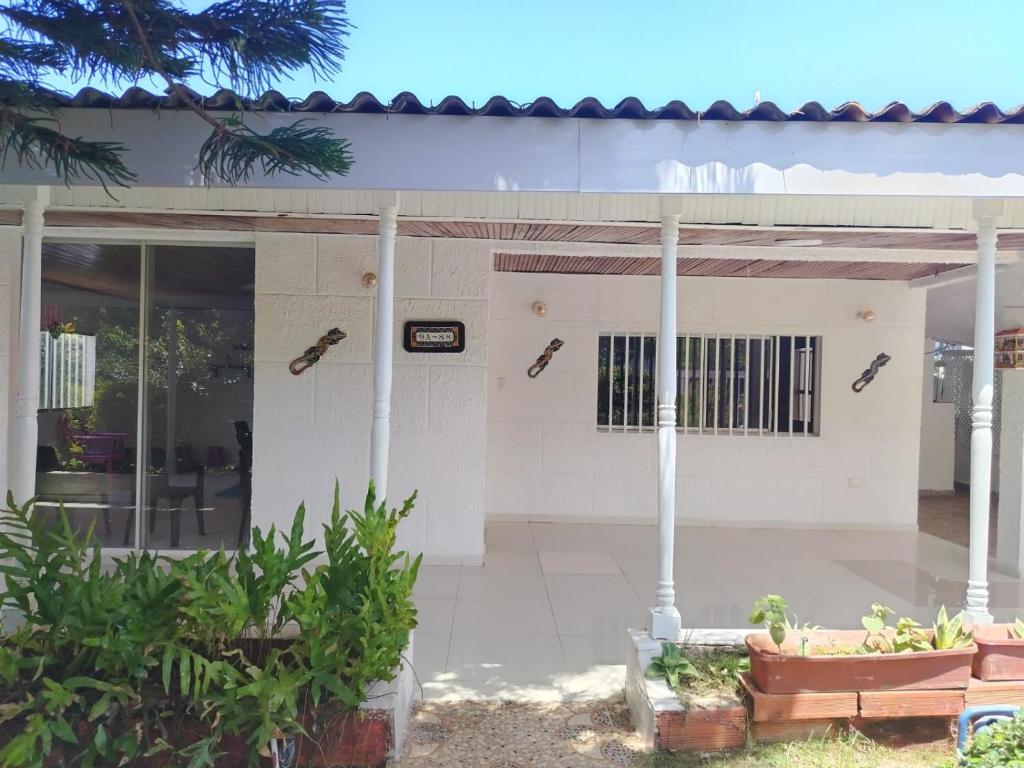 a white building with a sign on the front of it at Hostal Dream House in San Andrés