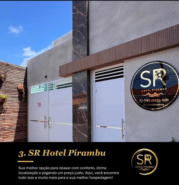 a building with a st hotel pharmacy sign on it at SR Hotel e Pousada Pirambu in Pirambu
