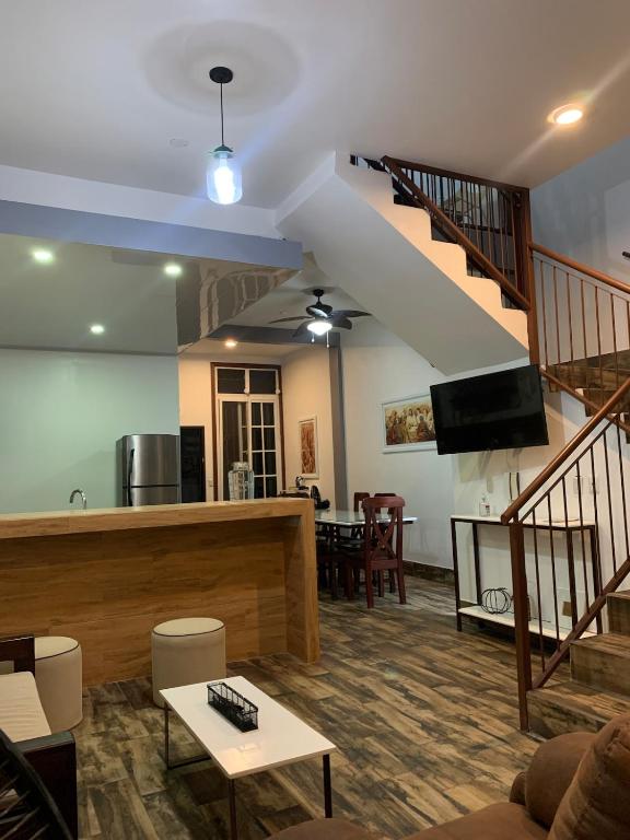 a living room with a staircase and a living room at Casa G&V X9 personas in Santa Elena