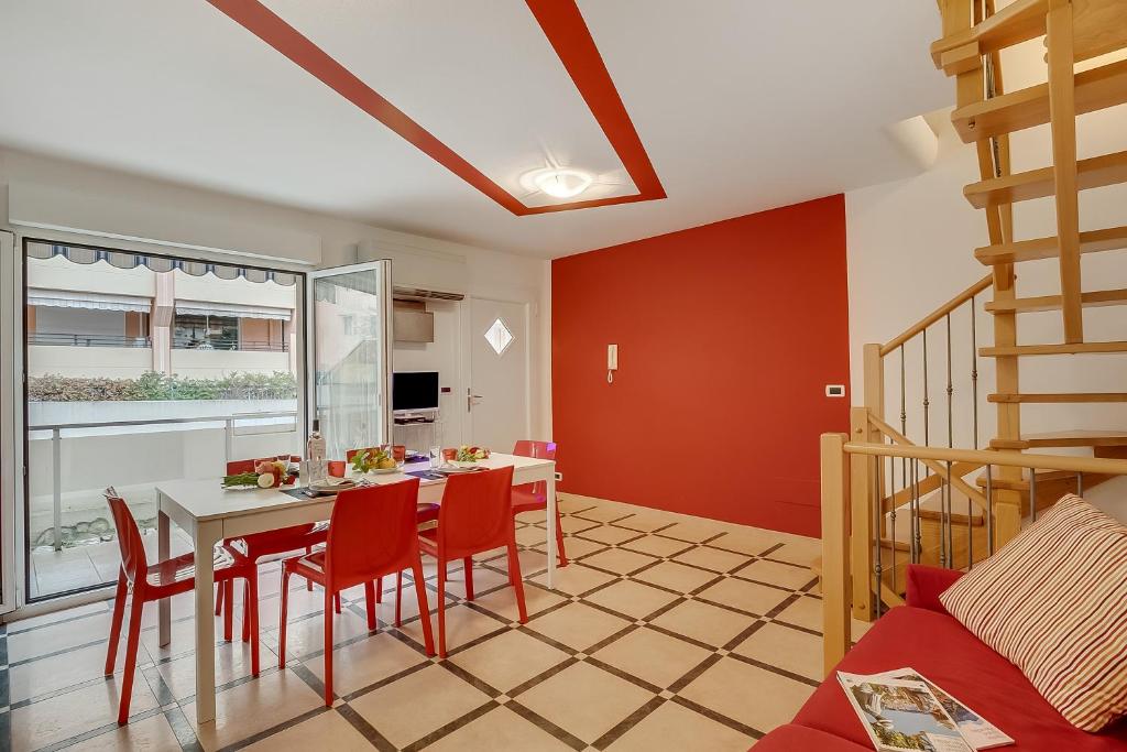 a kitchen and dining room with a table and chairs at Clementines 50 Meters From Sea - Happy Rentals in Roquebrune-Cap-Martin