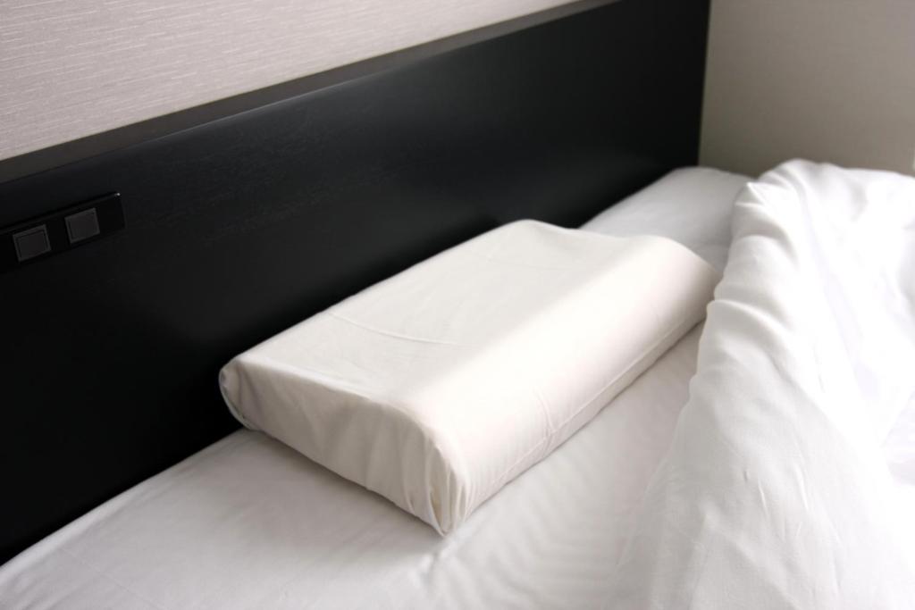 Postel nebo postele na pokoji v ubytování Hotel Crown Hills Kimitsu