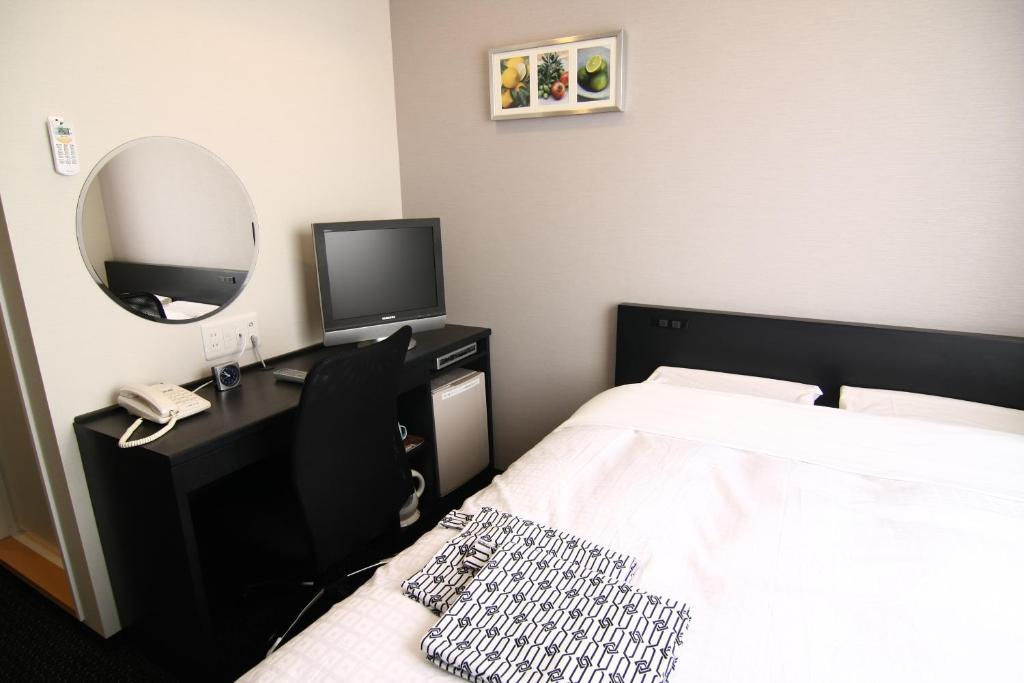 Postel nebo postele na pokoji v ubytování Hotel Crown Hills Kimitsu