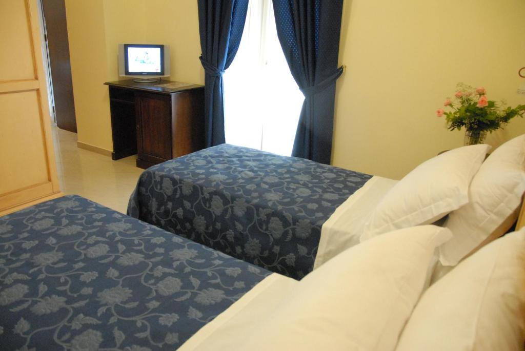 Postel nebo postele na pokoji v ubytování Garibaldi Relais