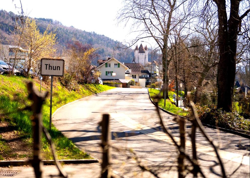 a street with a turn sign in a village at Central12 Apartment - Free Parking in Thun