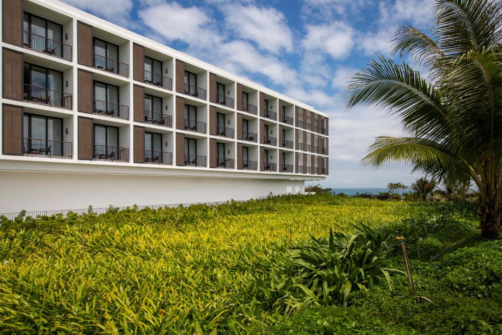 Deluxe Garden view with Two Double Beds and Balcony