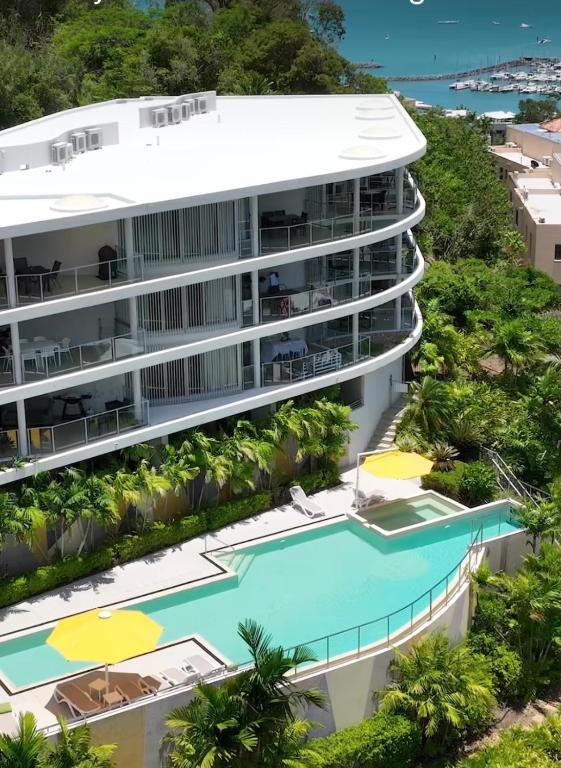 an aerial view of a building with a swimming pool at Salt & Sea in Airlie Beach