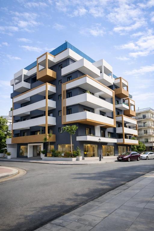 a building with balconies on the side of a street at The Edge Piraeus Luxury Residences in Piraeus