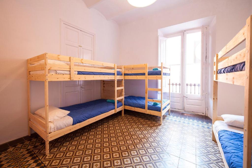 Postel nebo postele na pokoji v ubytování Bed in Girona