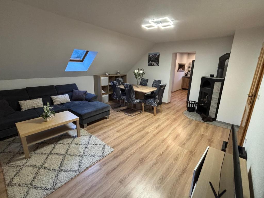 a living room with a couch and a table at Ferienwohnung Grünblick am Katschbach in Teufenbach