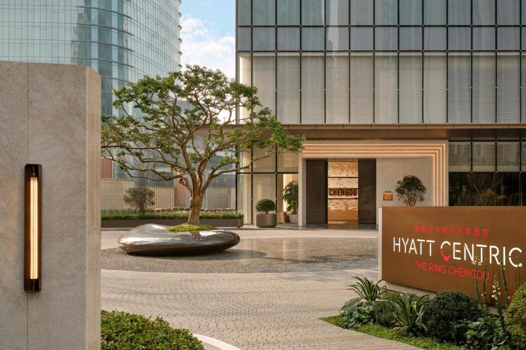 a rendering of a building with a sign in front of it at Hyatt Centric The Ring Chengdu in Chengdu