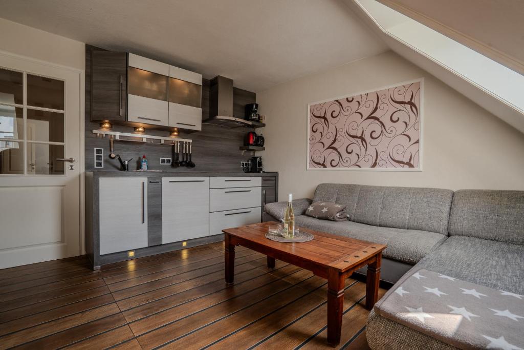 a living room with a couch and a table at Lister Tor 13 in List
