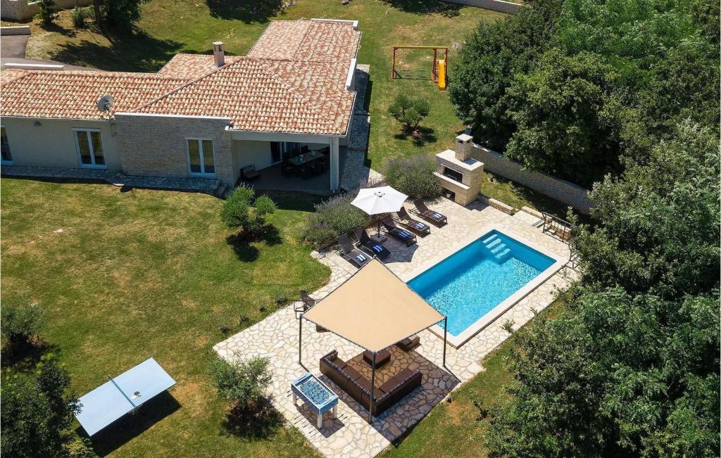 an aerial view of a house with a swimming pool at Villa Hemera - Oasis of Peace and Privacy by Istrabook in Kršan