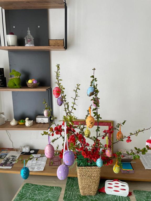 a desk with christmas ornaments and a plant on it at Happy M&S 2 in Šabac