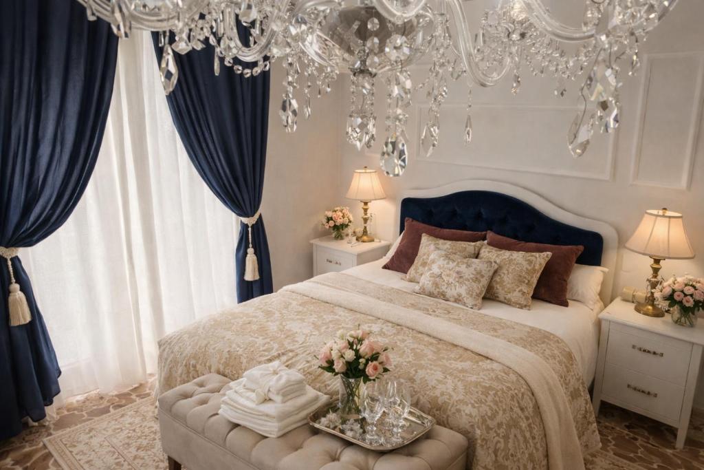 a bedroom with a large bed and a chandelier at Il Castello Di Venere in Rota d'Imagna
