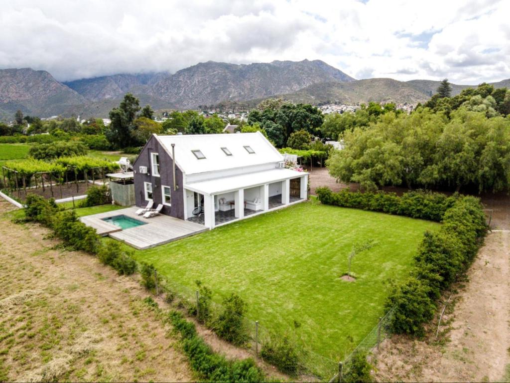 an aerial view of a house with a large yard at The Barn On 62 - Cottages in Montagu