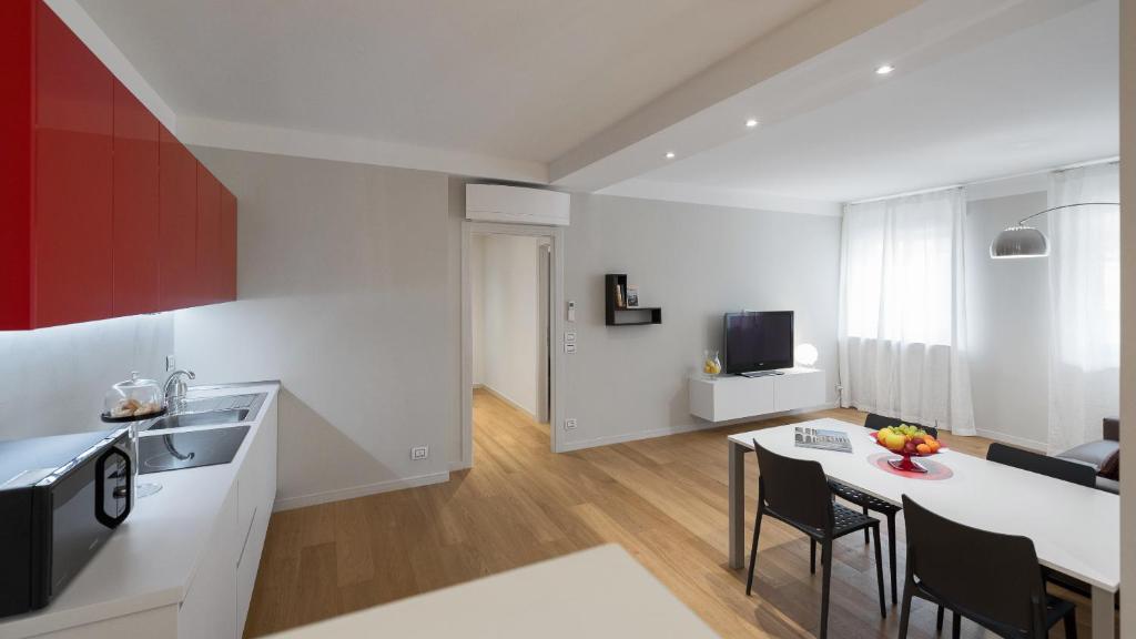Televízia a/alebo spoločenská miestnosť v ubytovaní Flats4rent