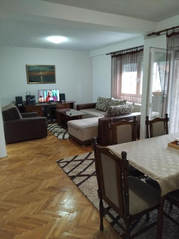 a living room with a couch and a table at Apartment TiBi in Kumanovo